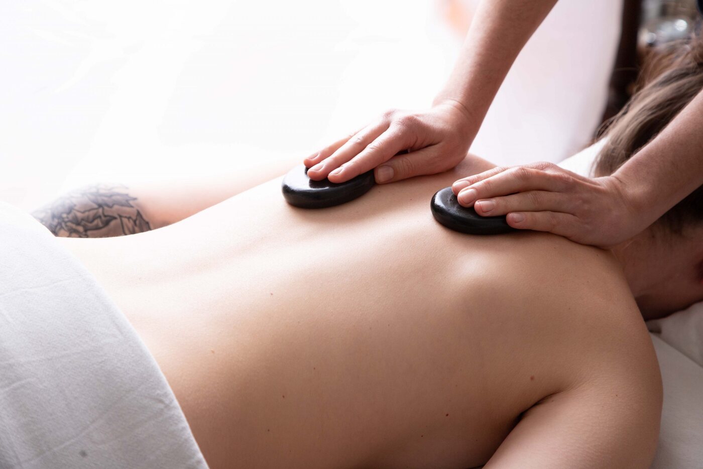 Hot stones used during a Wild Rose massage