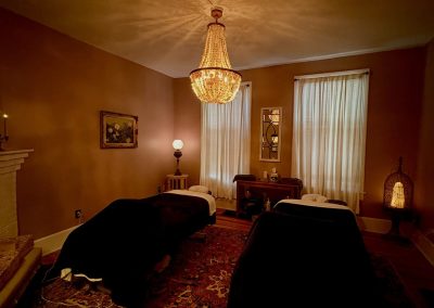 Couples treatment room with fireplace and candlelight