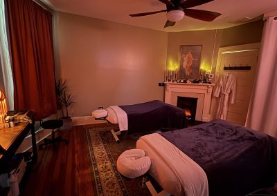 Couples suite with fireplace glow and soft robes