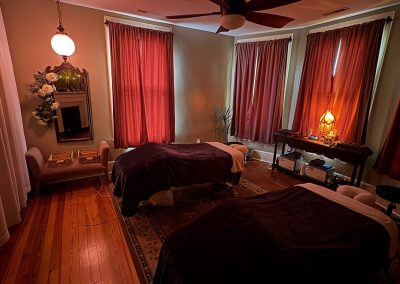 Rose-curtained couples room in warm evening light